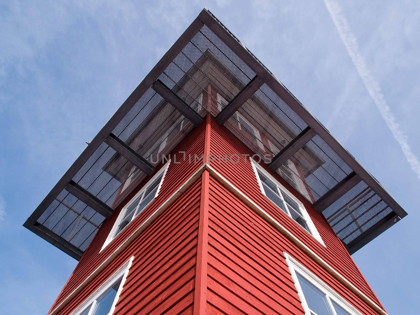 Watchtower facing blue sky down to up perspective