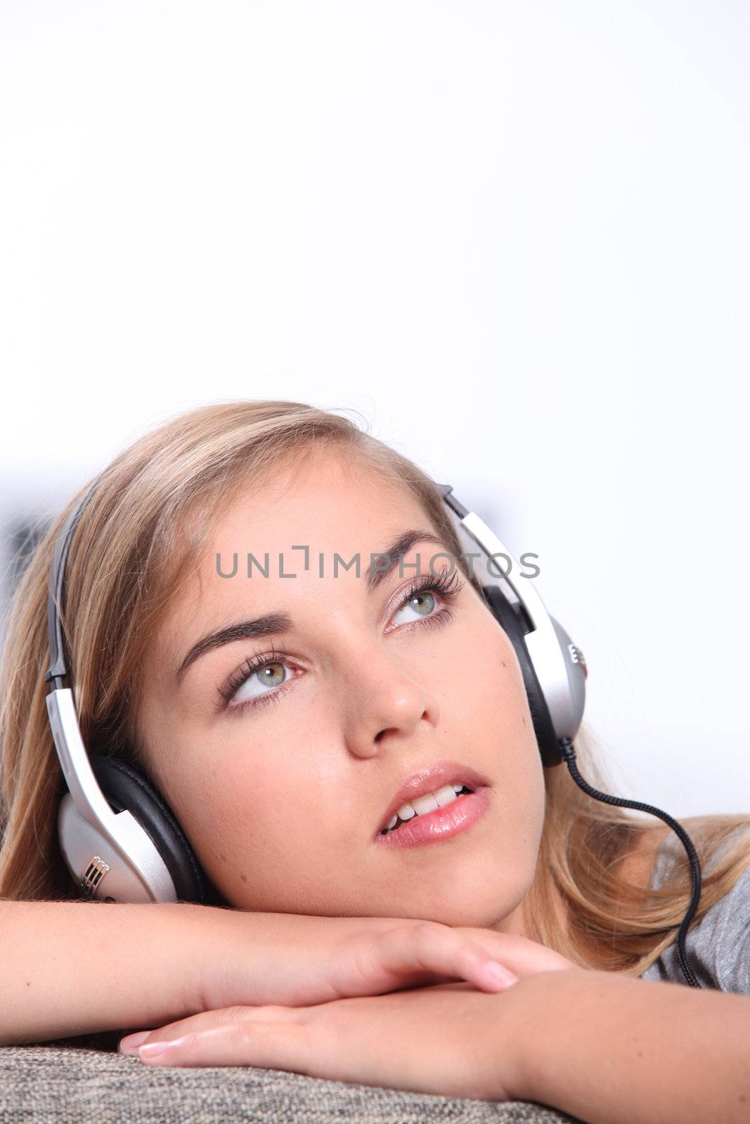 Girl listening to music on headphones