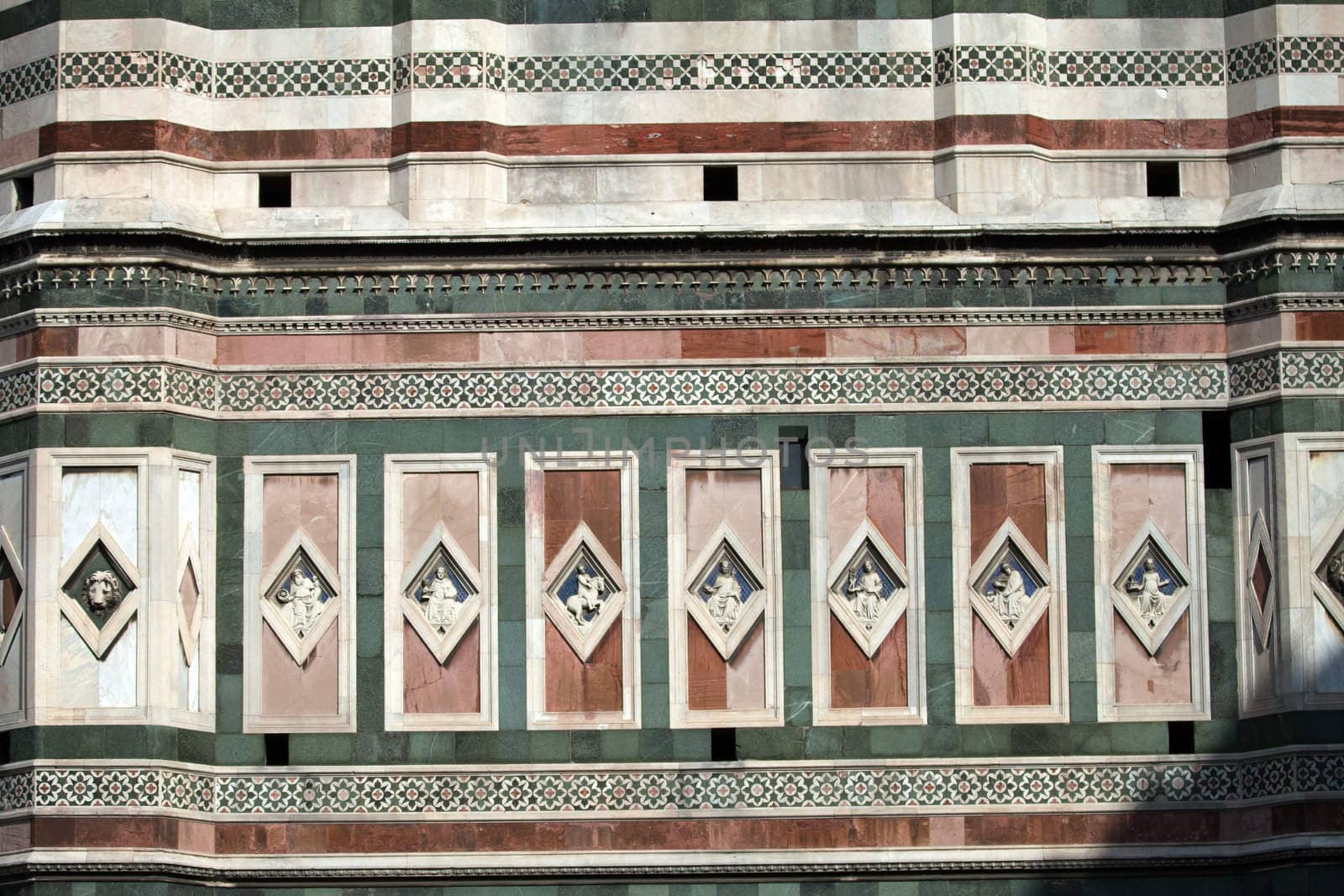 Florence - marble panels with low relieves on one of walls of the Giotto's tower
