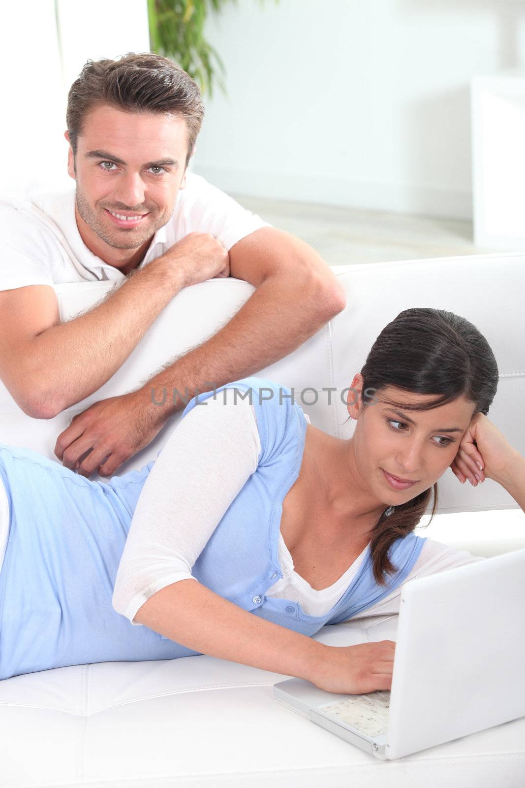 Couple sat in living-room