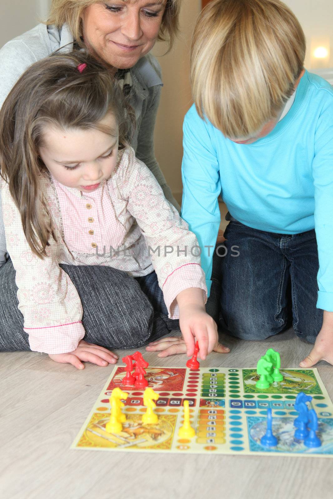 Grandmother watching her grandchildren play a game