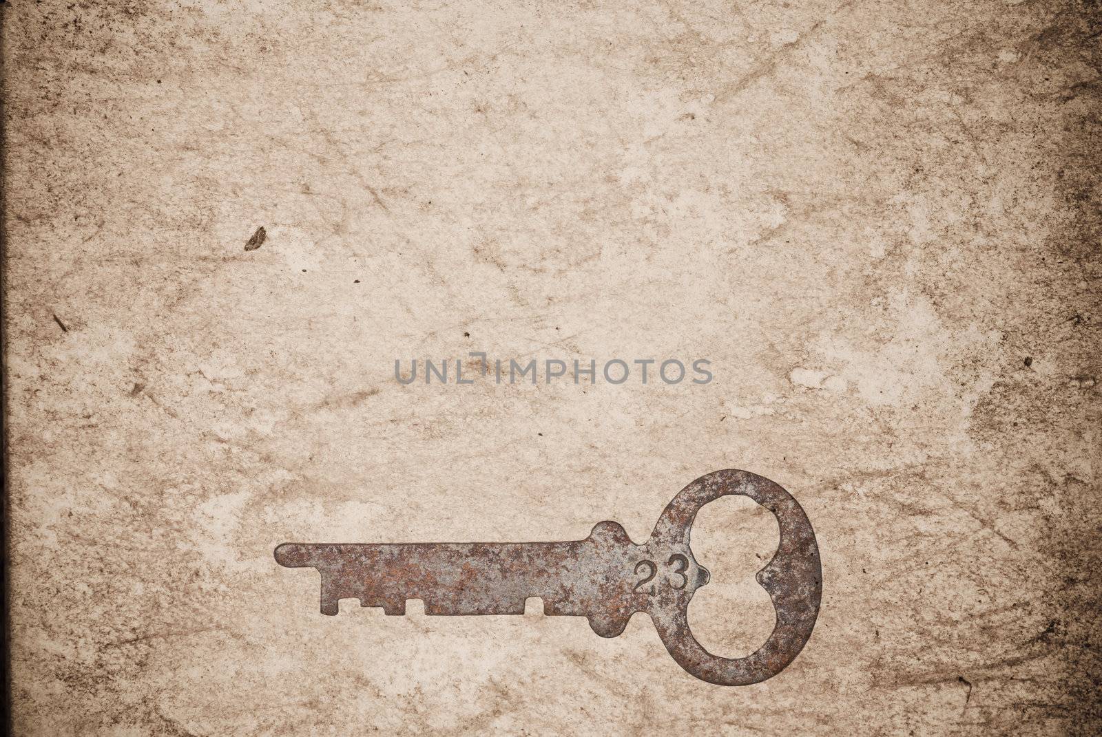 Rusty keys on old paper background with blended layers