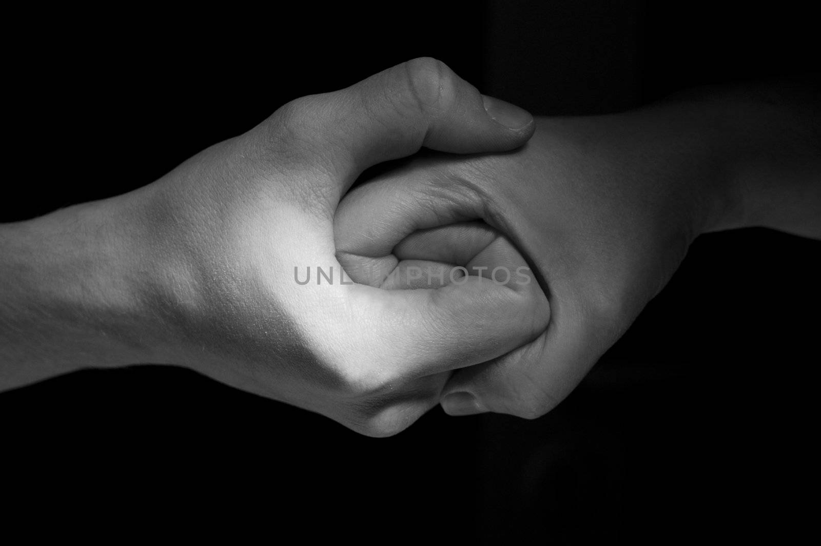 Two hands unite with eachother in special symbol