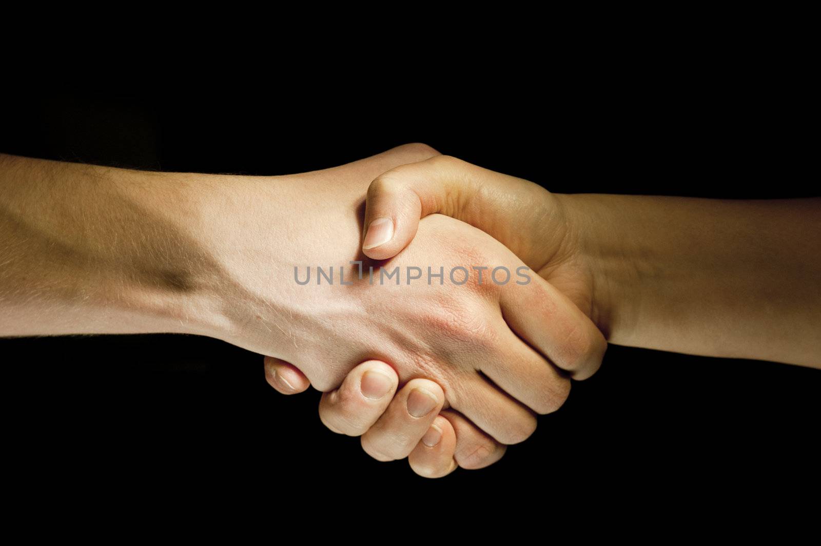 Lighted two hands unite with eachother as agreement