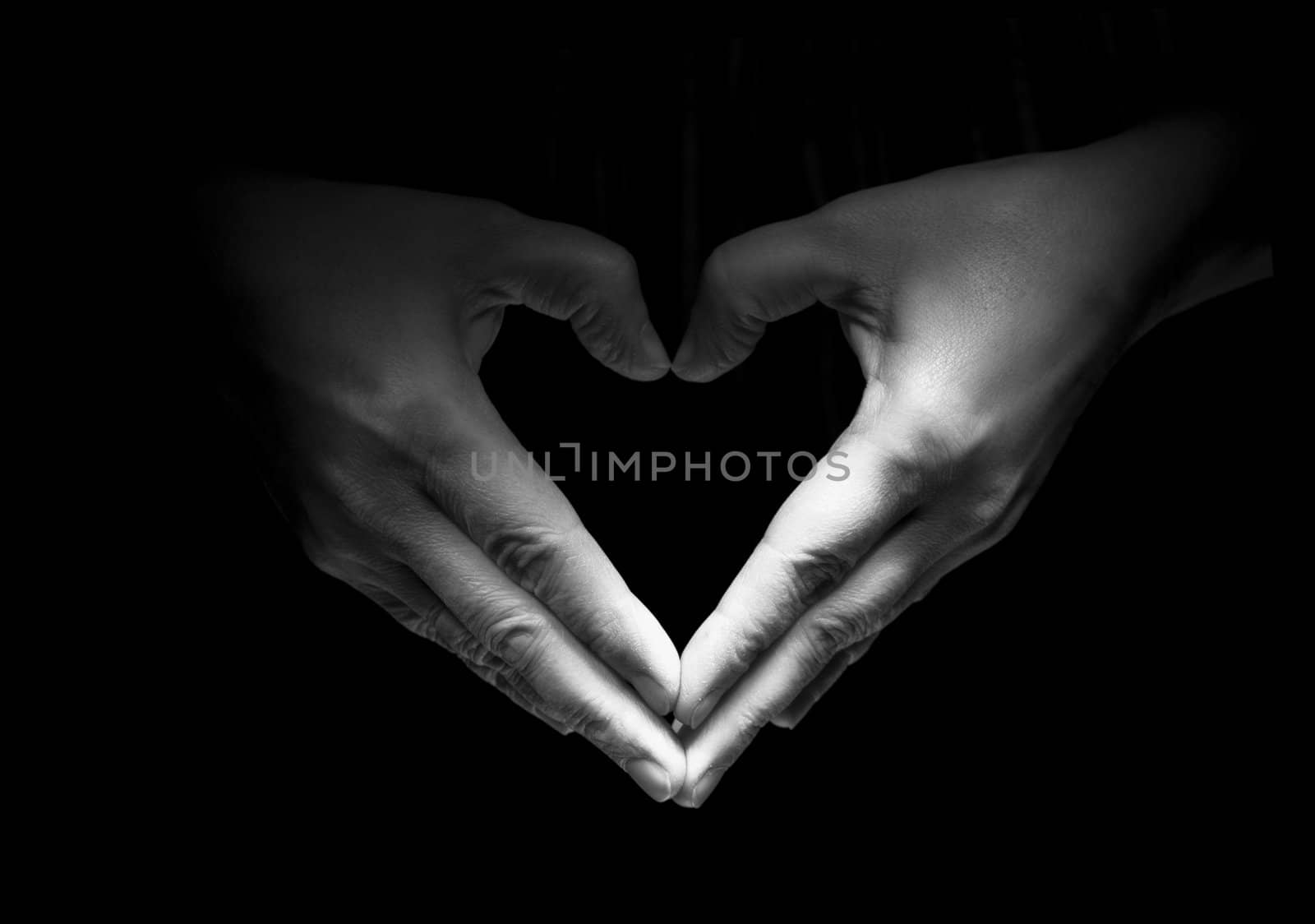 Two hands unite with eachother in love symbol