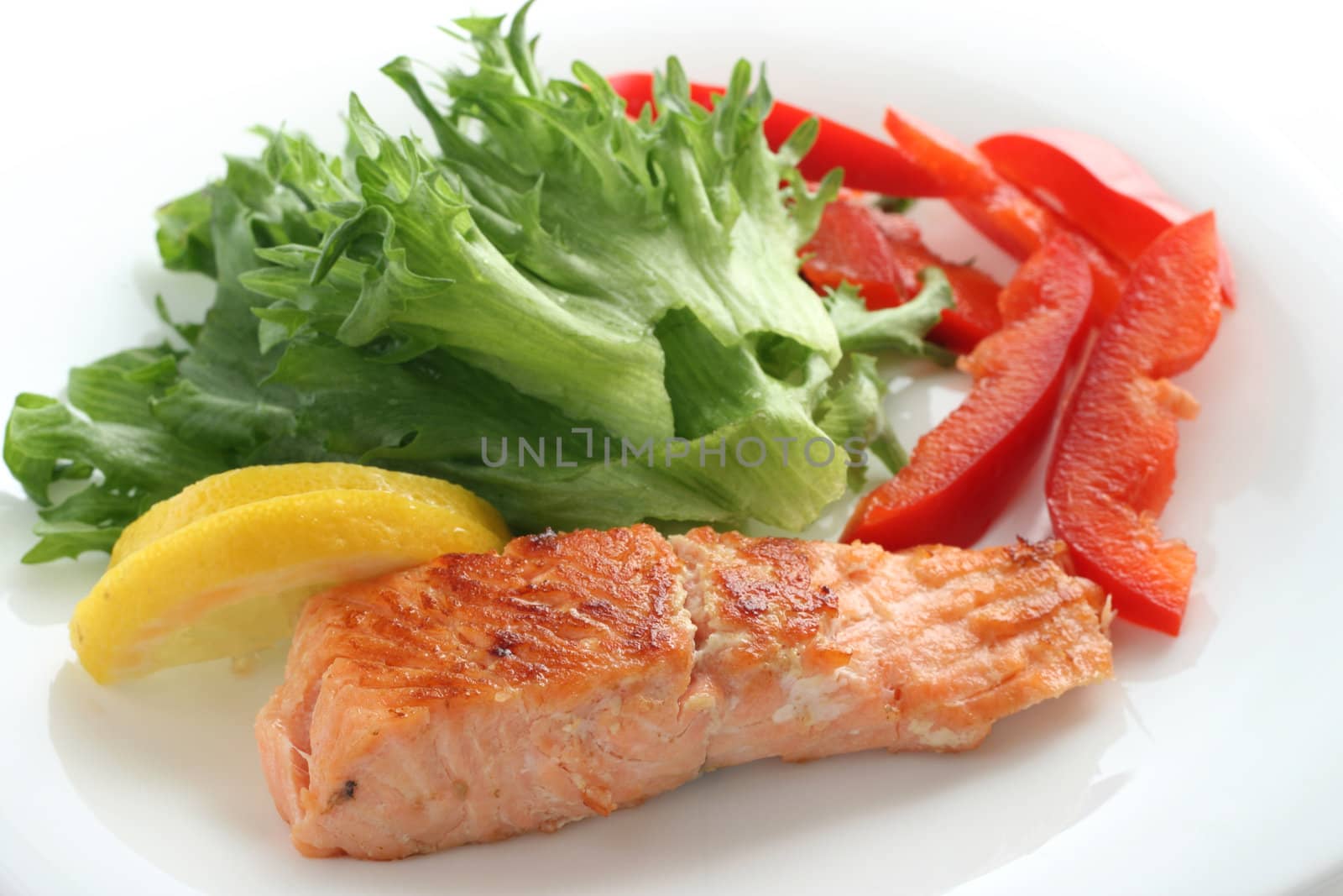 fried salmon with salad