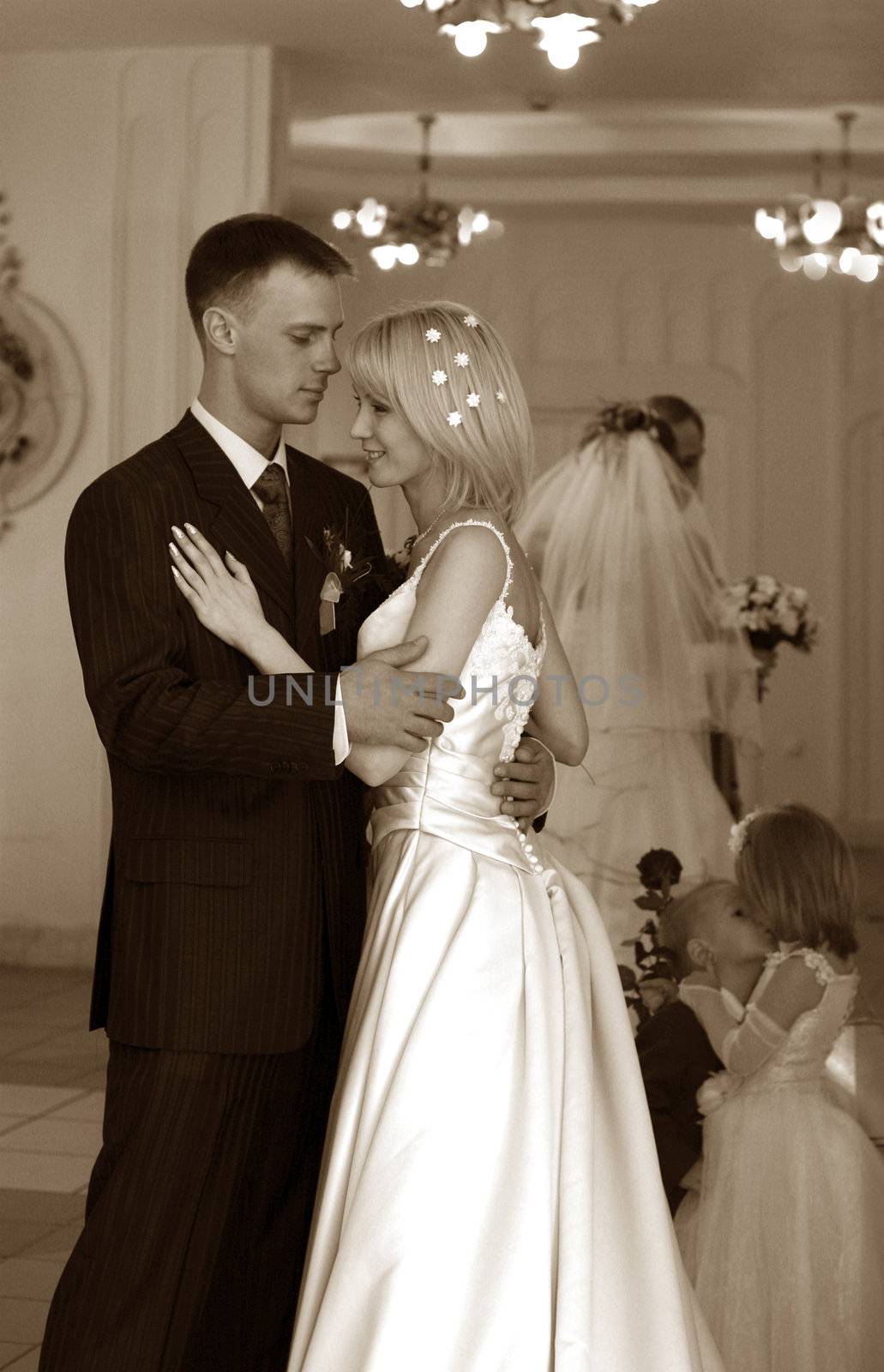 Bride and groom and their children before ceremony