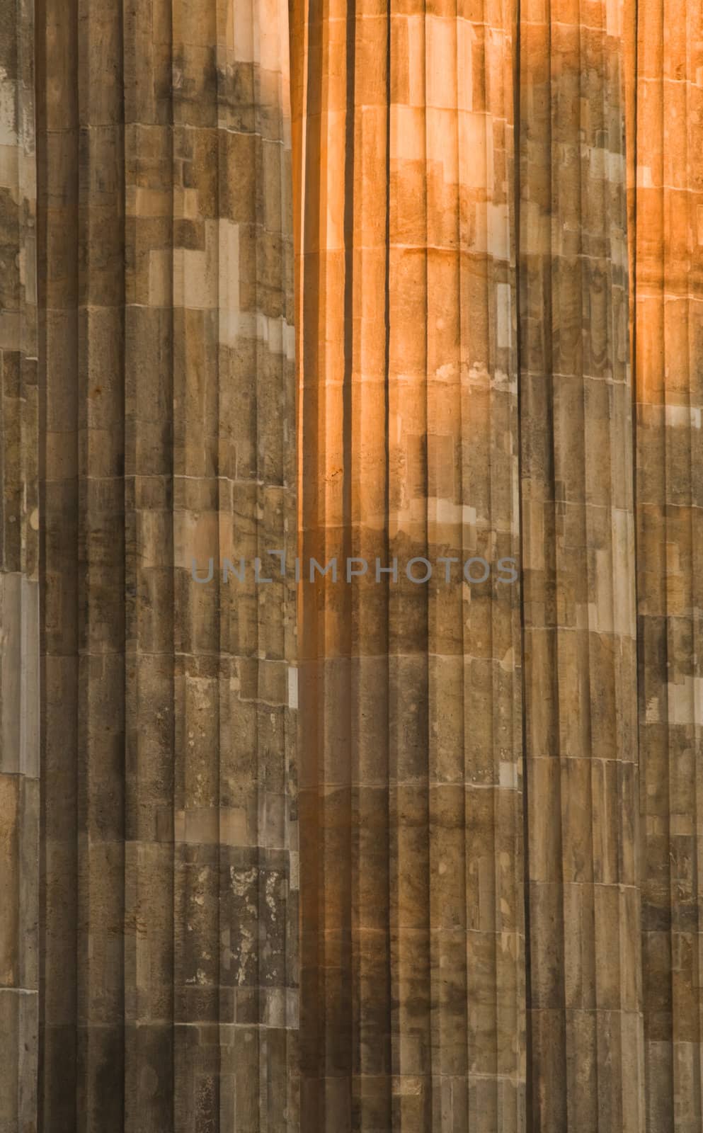 Dusk lighting detail of the Brandenburger Gate's columns in Berlin.