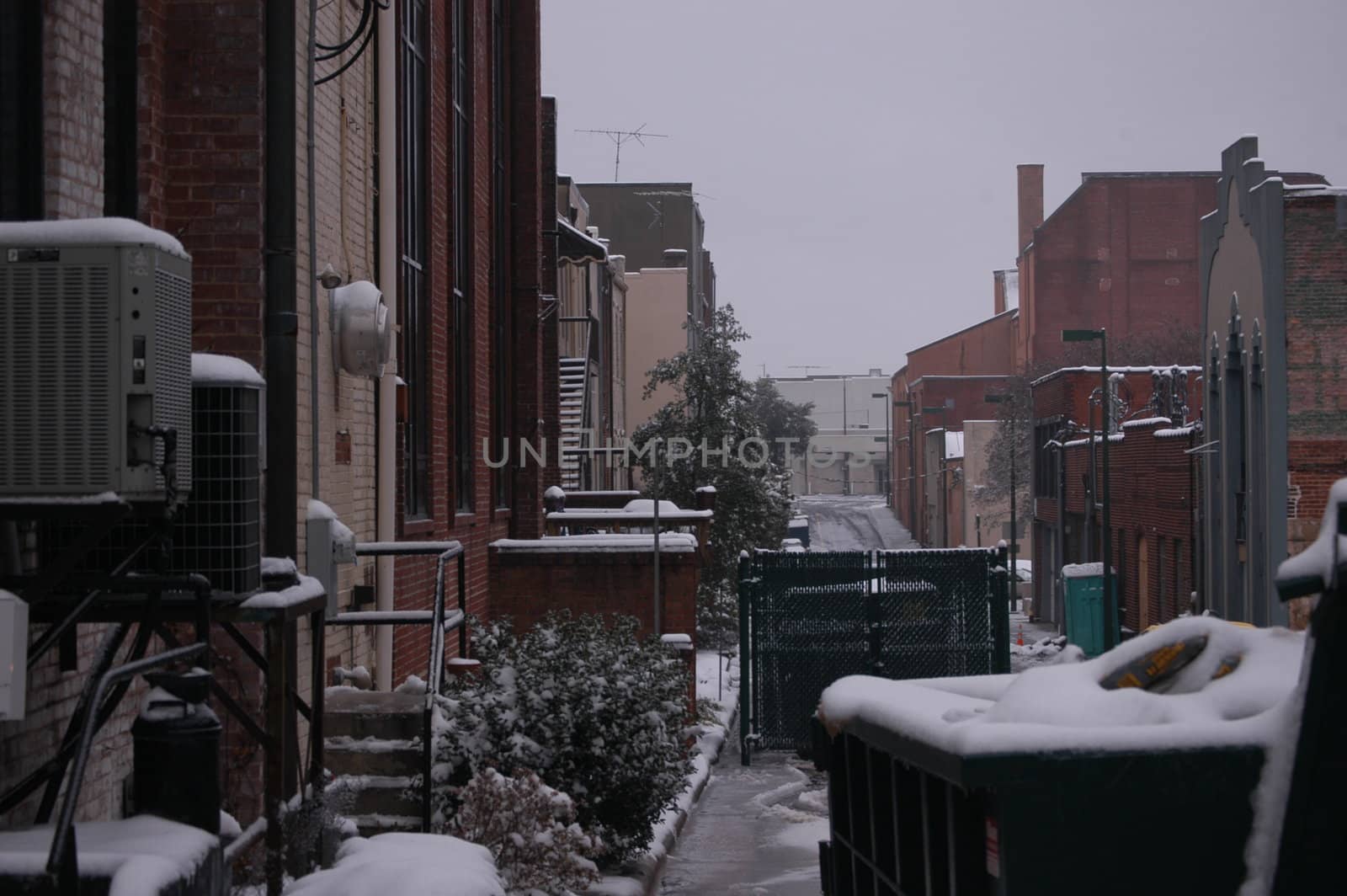 Behind every city is a back alley, This one is seen in the winter time.