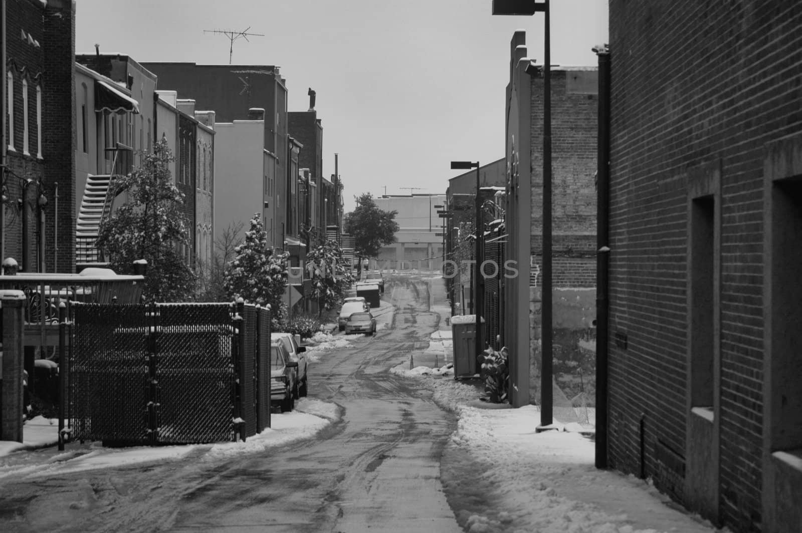 Behind every city is a back alley, This one is seen in the winter time.