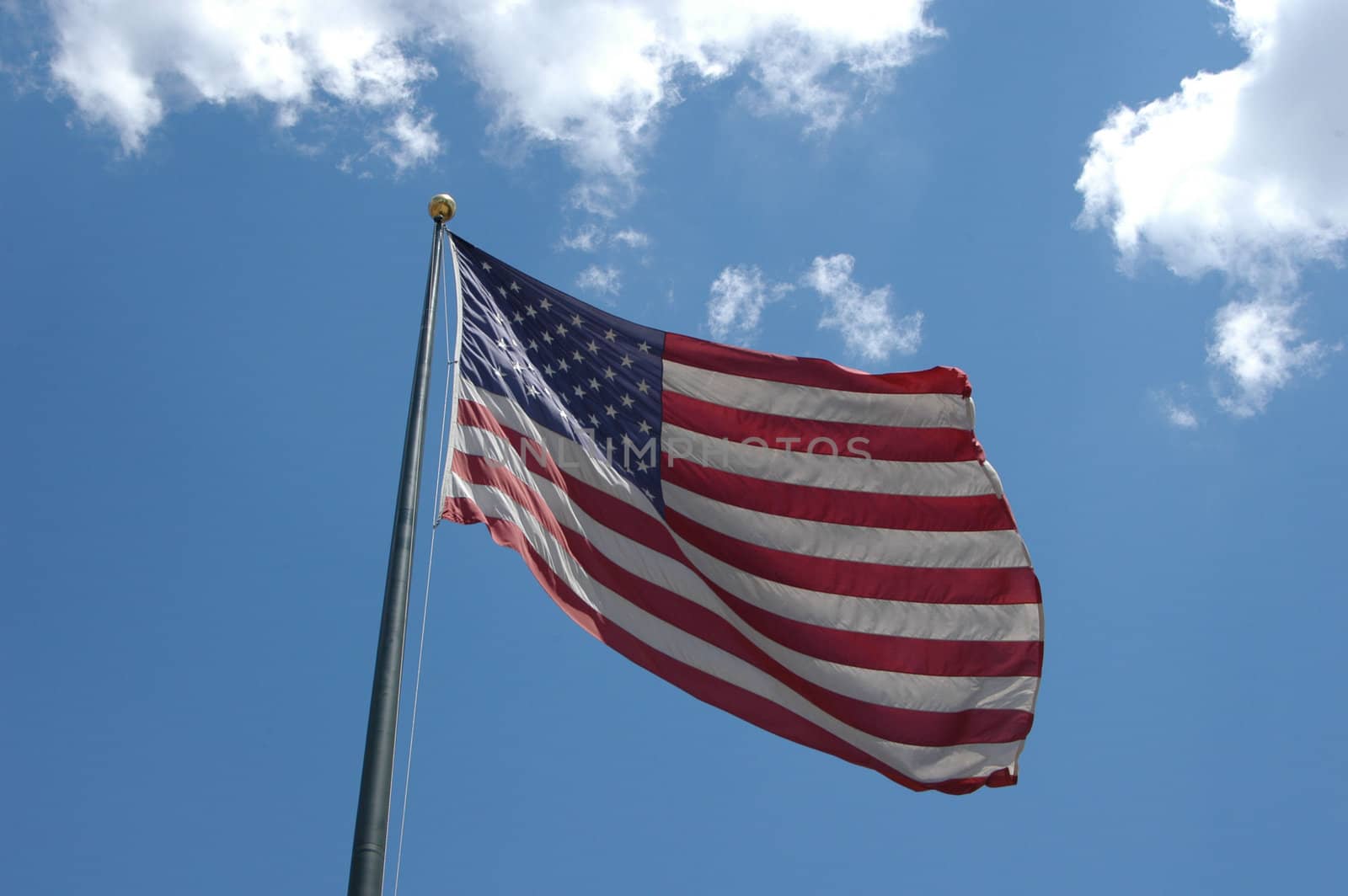A large American flag flying in the breeze