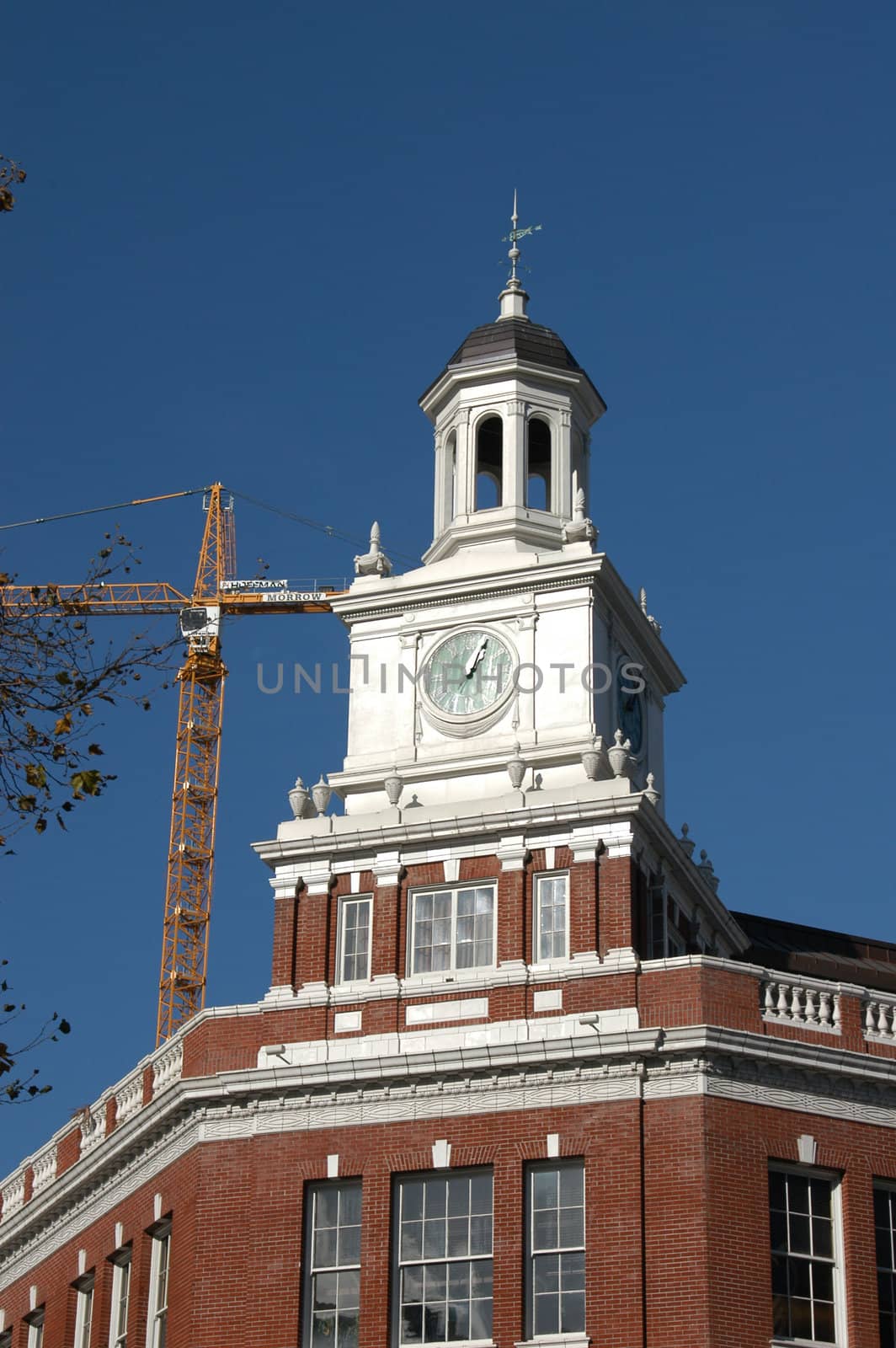 A clock tower in Portland Oregon under repair