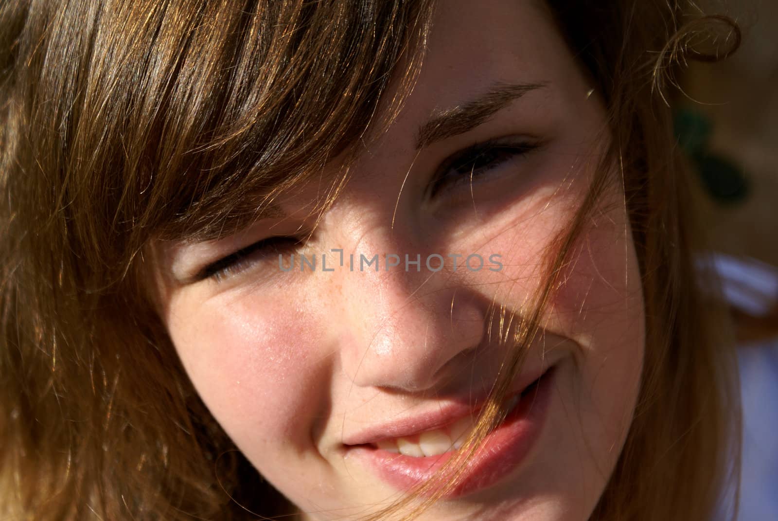 Teenage girl, looking in sunlight.