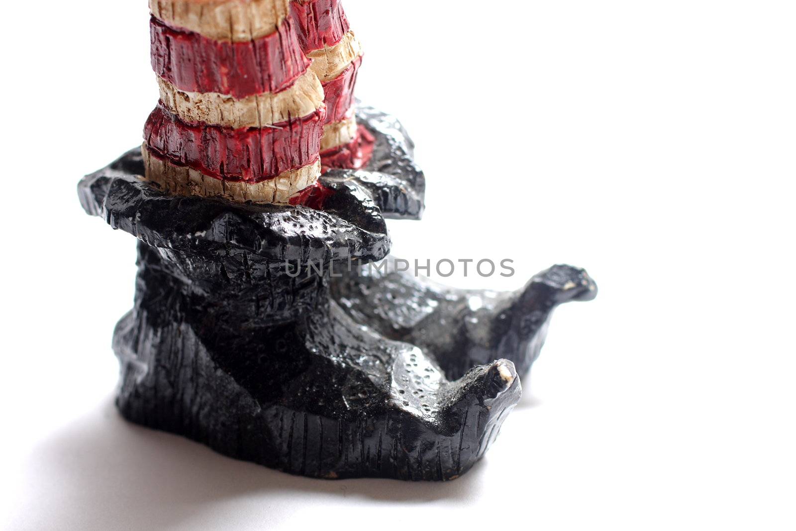 Wooden carving of elf slippers on white background