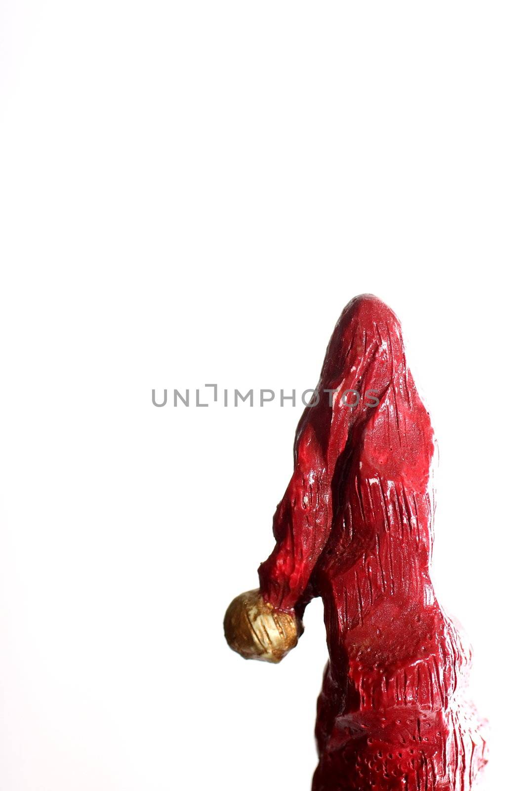 Wooden carving of Santa cap on white background