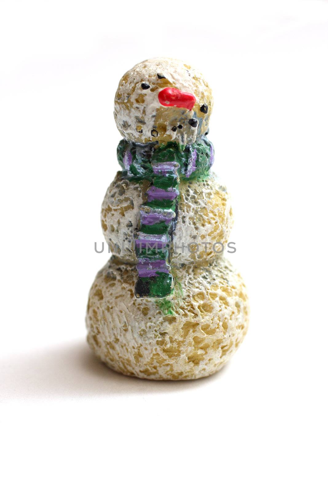 A wooden snowman figurine on white background