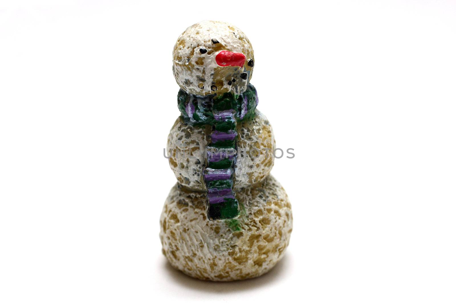 A wooden snowman figurine on white background