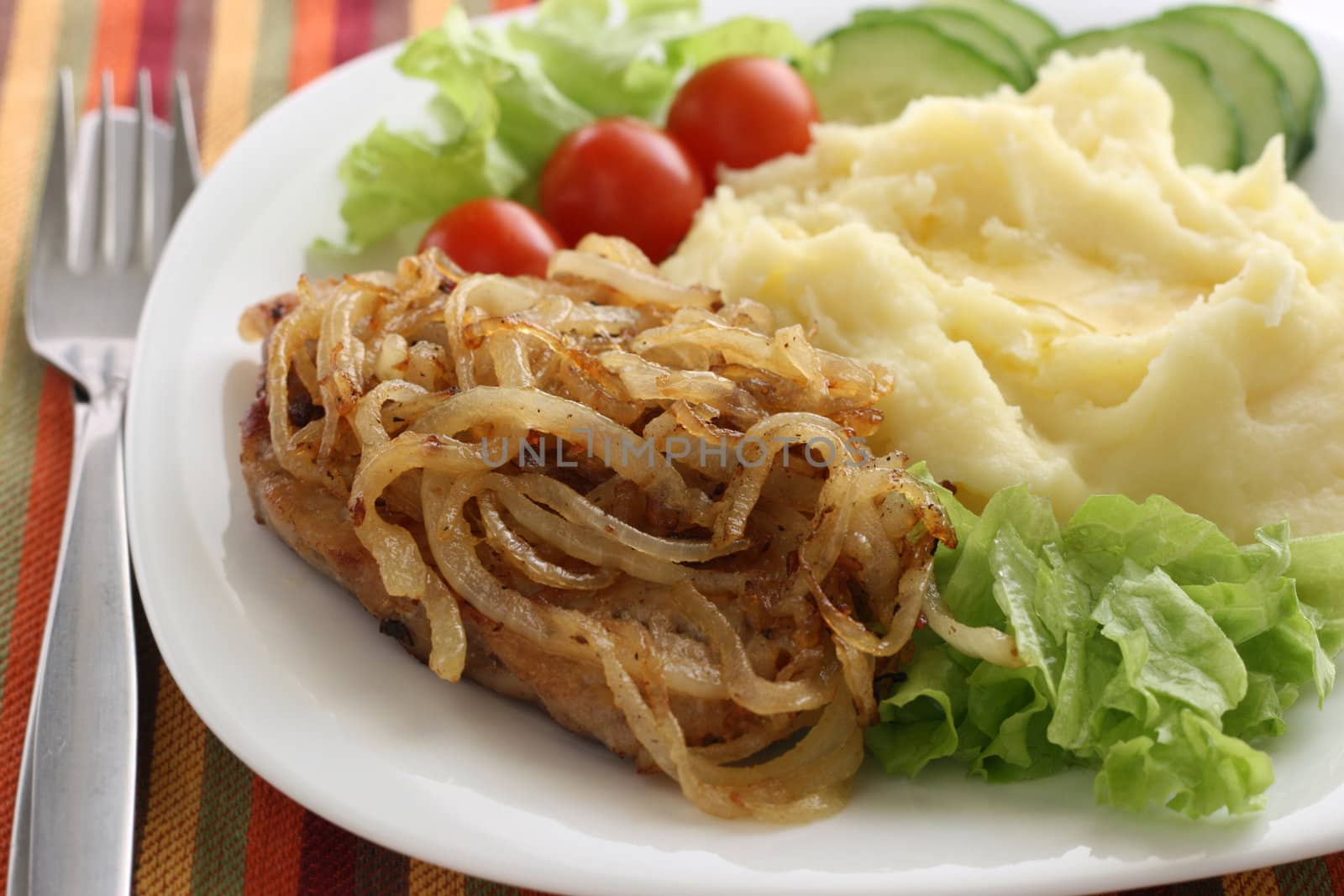 fried pork with onion and mashed potato