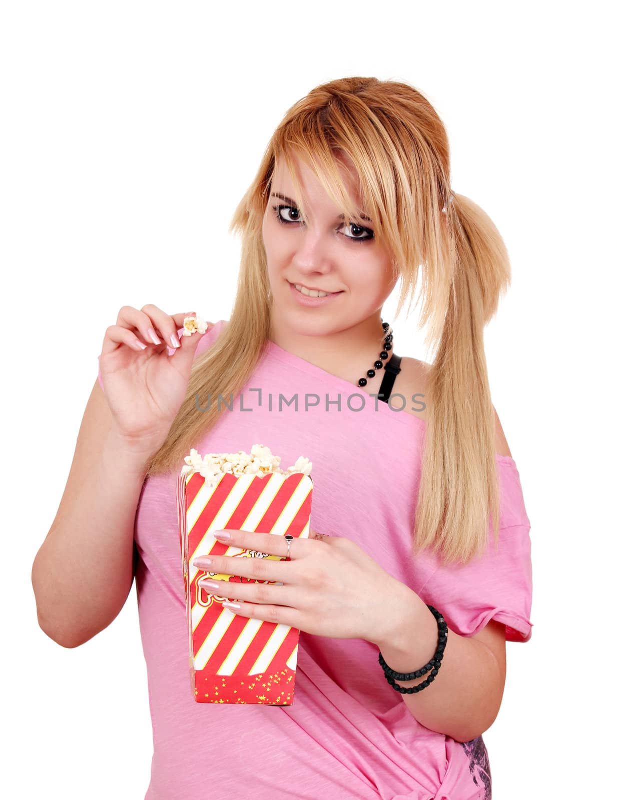 beautiful teenage girl eat popcorn by goce