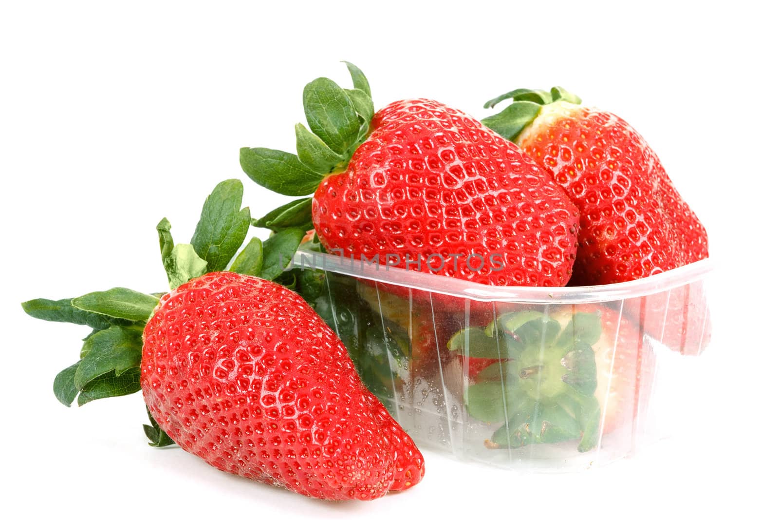 fresh strawberries in box on white background