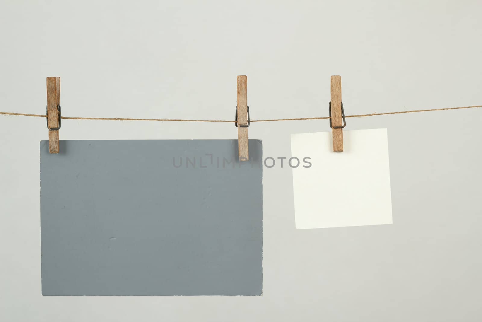 white and grey memory note papers hanging on cord