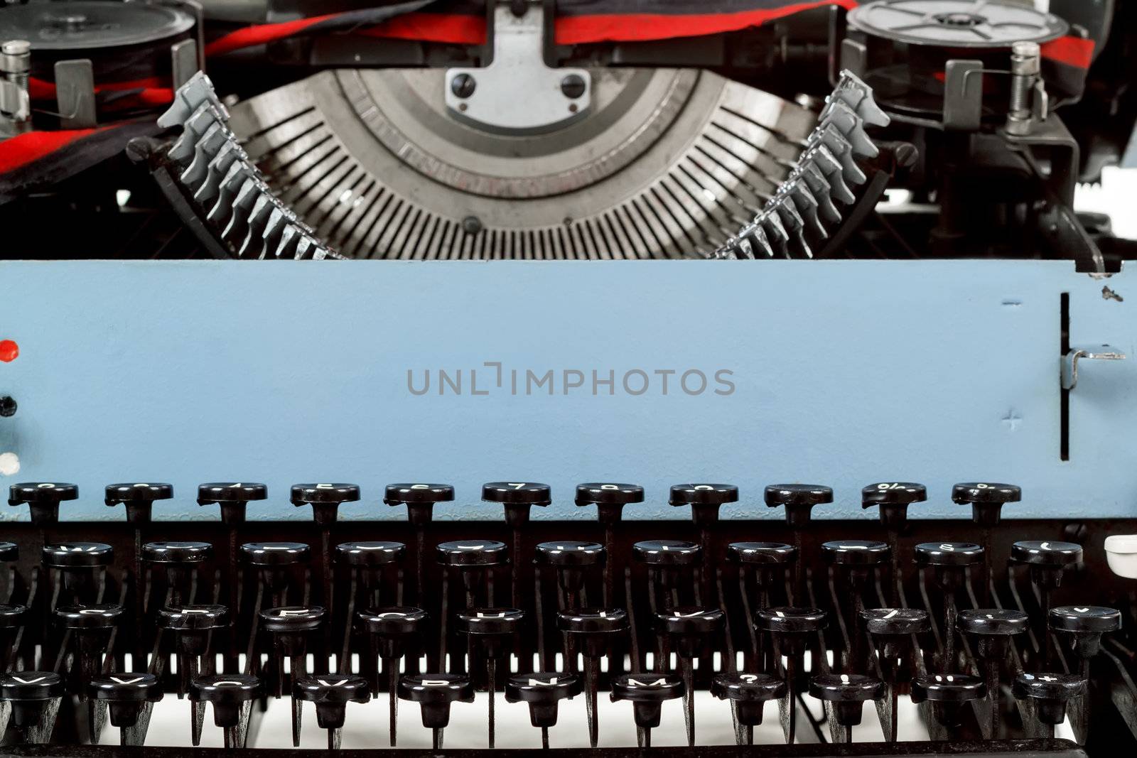 retro typewriter close up with number keys and letters mechanism