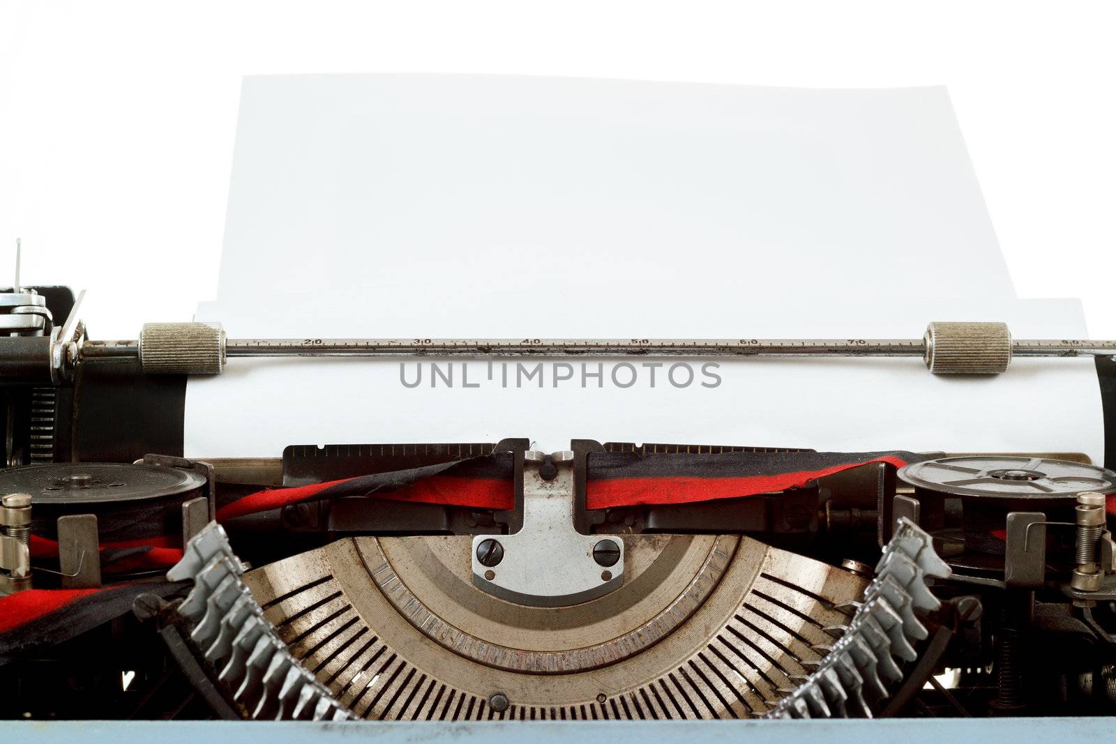 retro typewriter close up with paper and letters mechanism