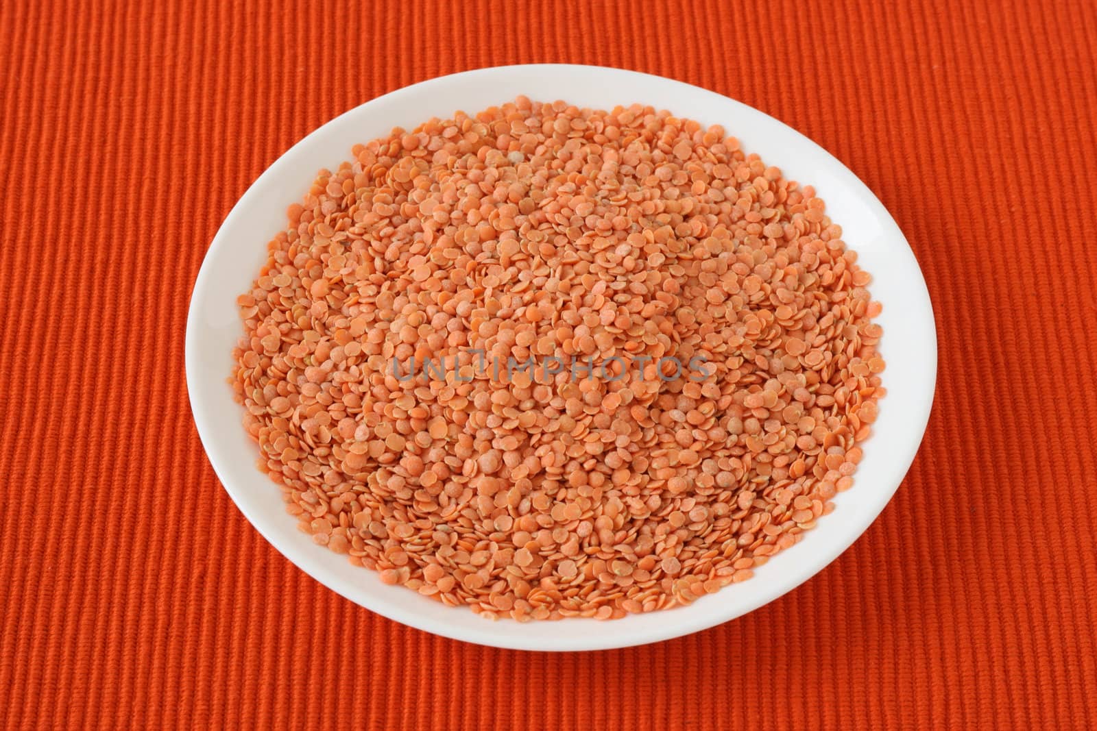 dry red lentil on the plate