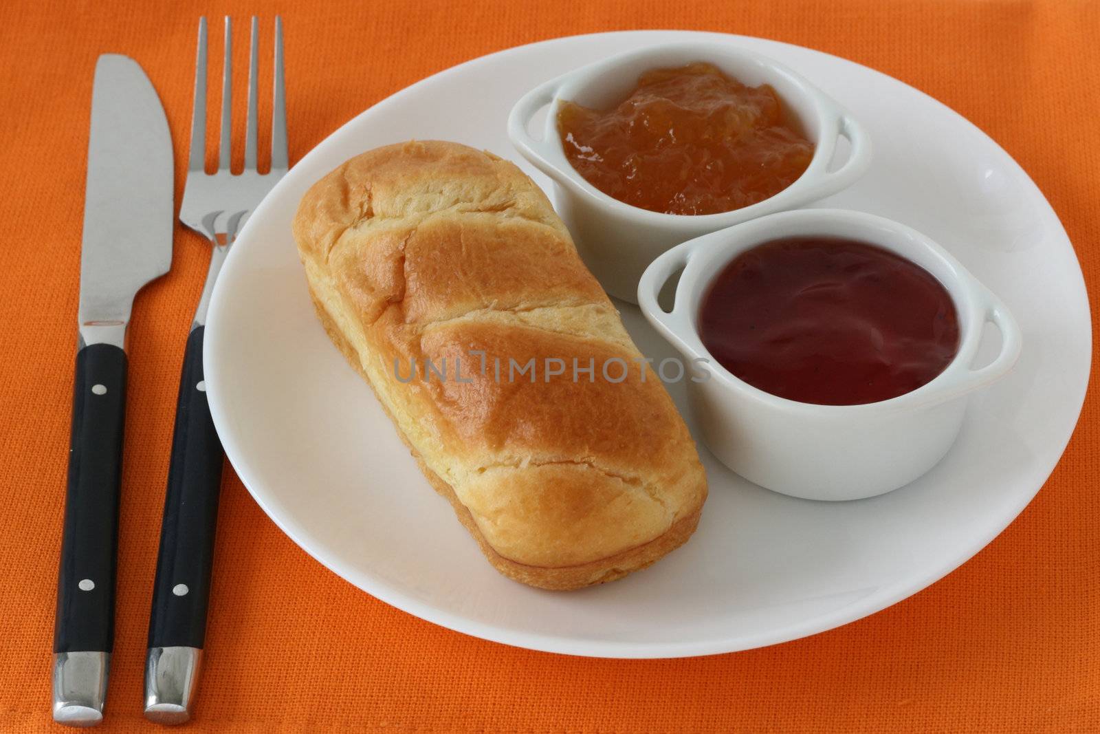 bread with jam in bowls