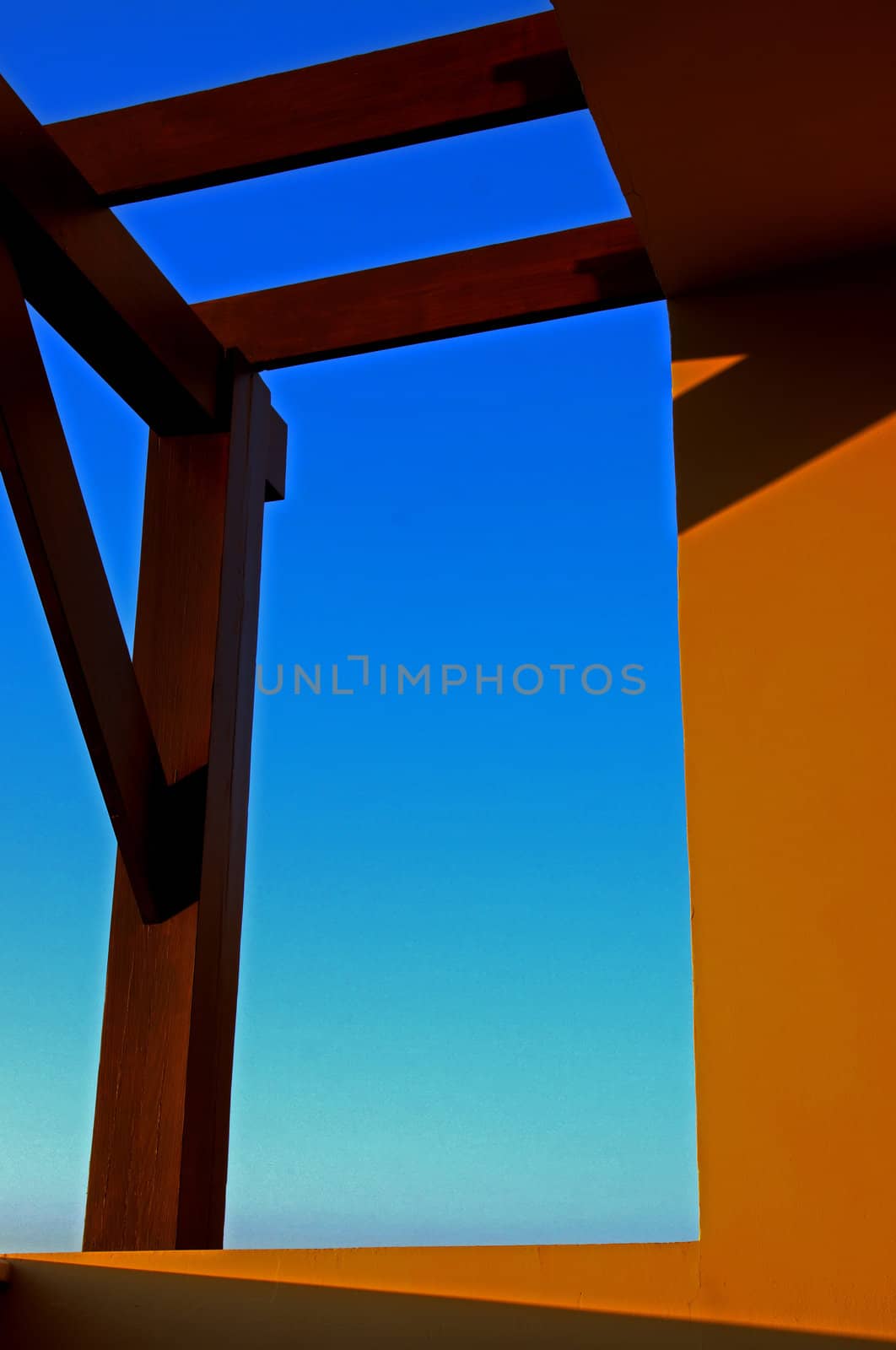 Sunset shadow and warm beams with orange glow on  a tropical balcony