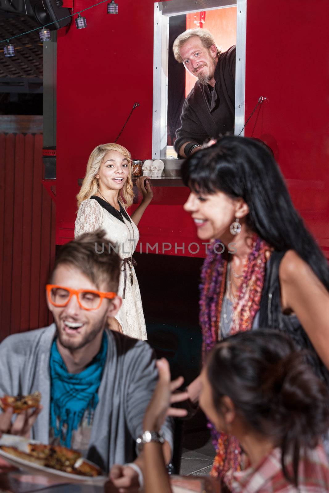 Cute Black woman waiting for order at food truck