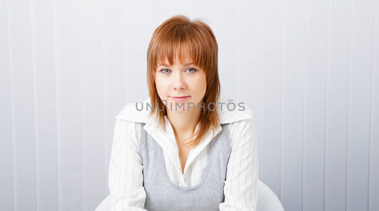 blue-eyed attractive young businesswoman in office