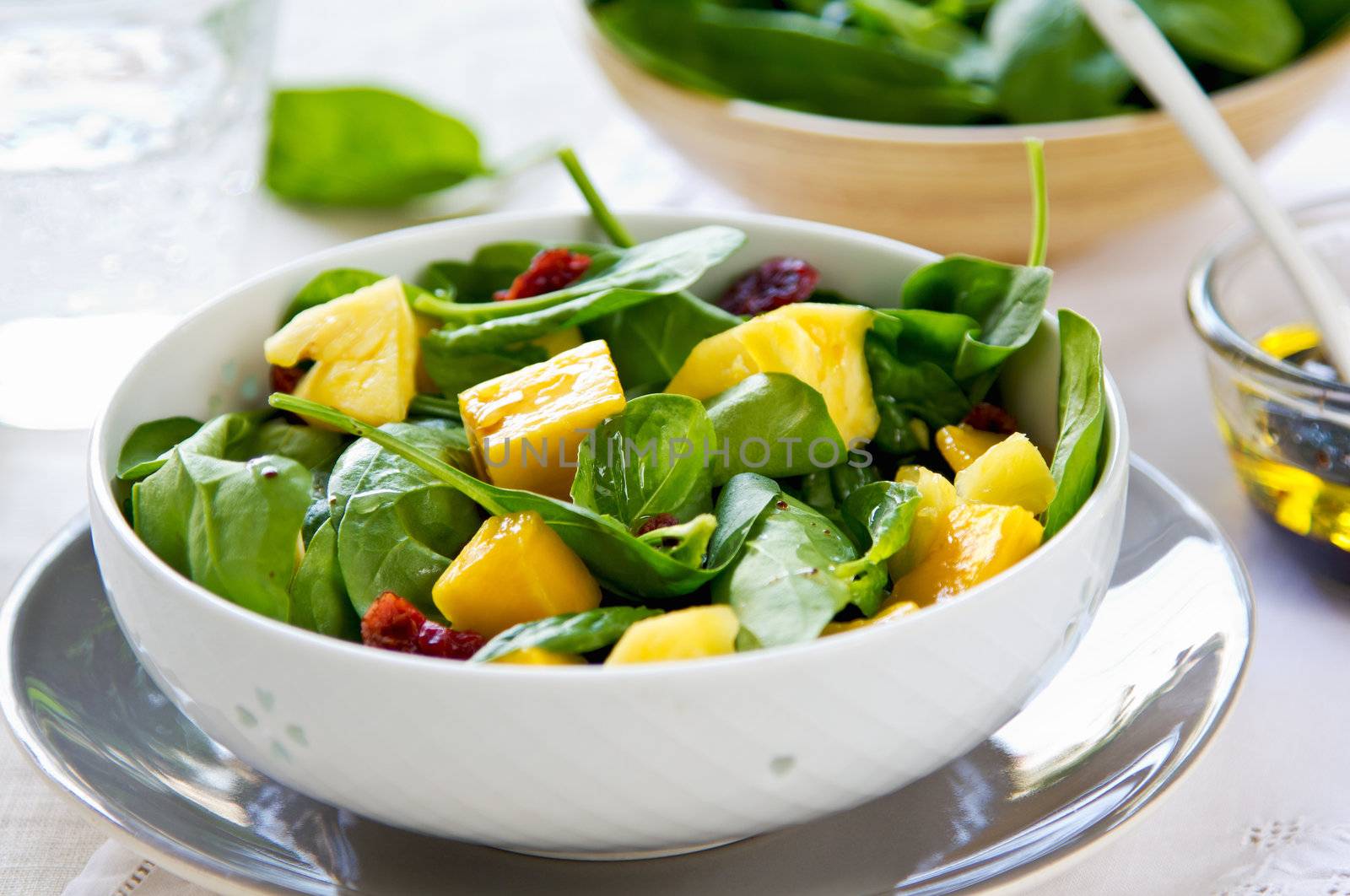 Mango and Pineapple with Spinach and dried cranberries salad