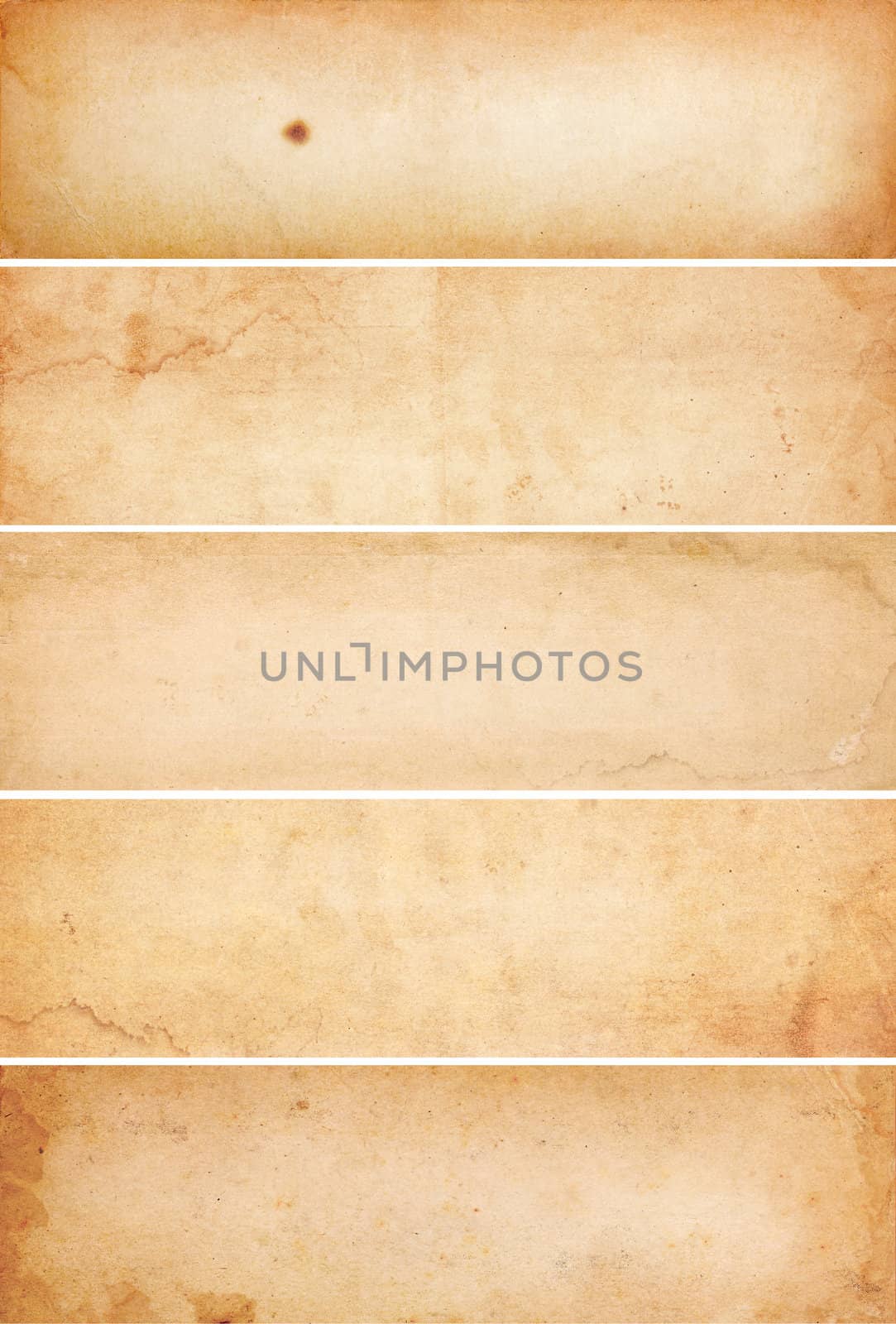 Collection of five heavily aged and water stained blank paper banners.  Isolated on white.
