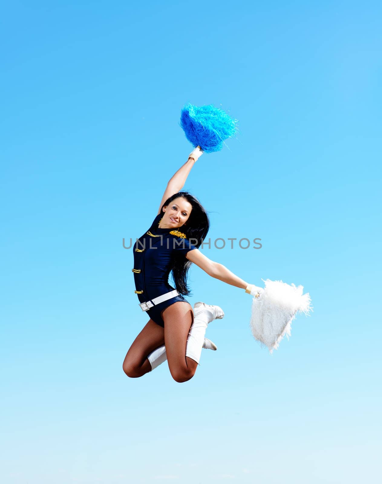 cheerleader girl jumping on a background of blue sky