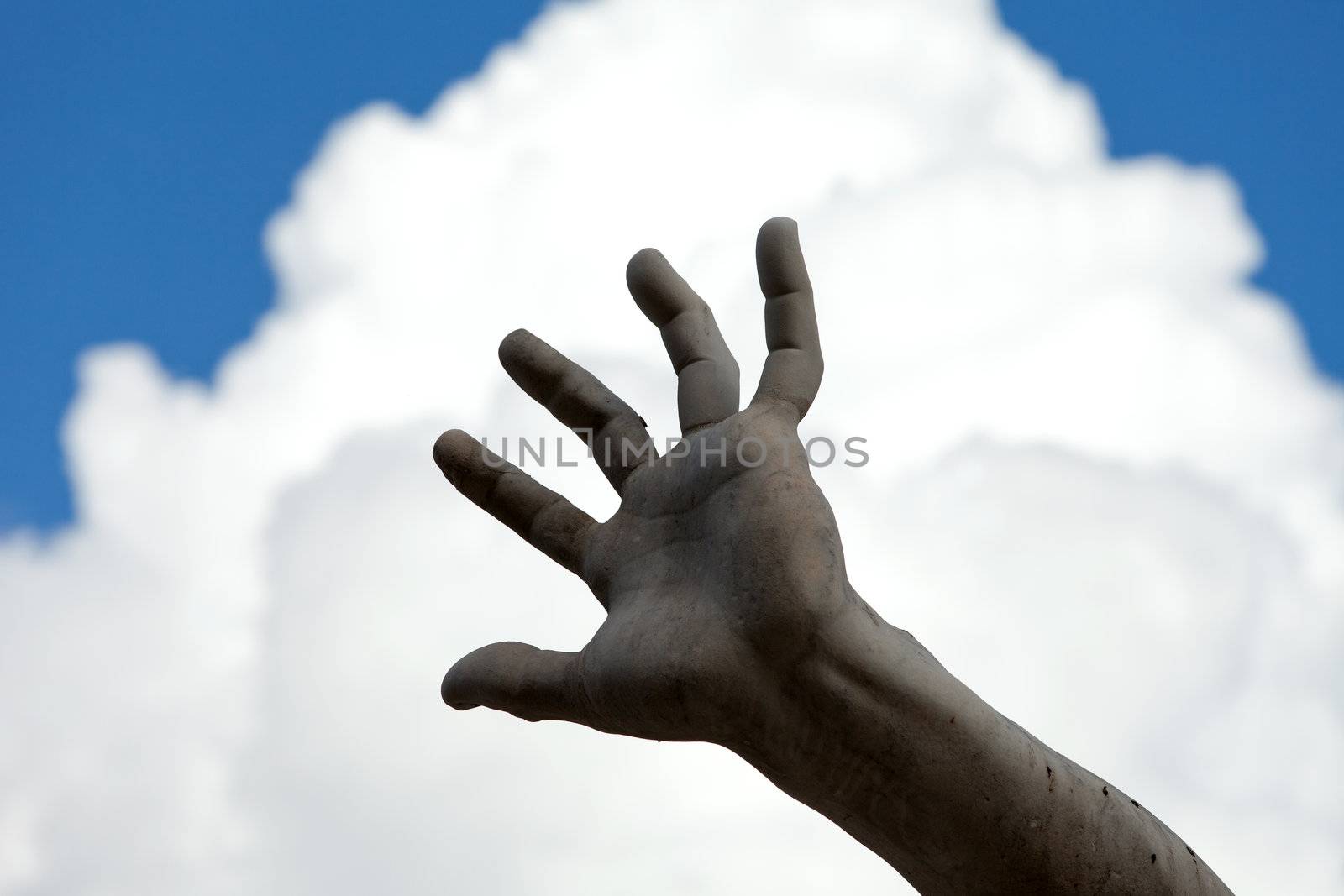 the stony hand against the background of the sky. Roma - Piazza Navona square, Italy. Detail of the Fountain of the Four Rivers, showing of the river-god Ganges. 