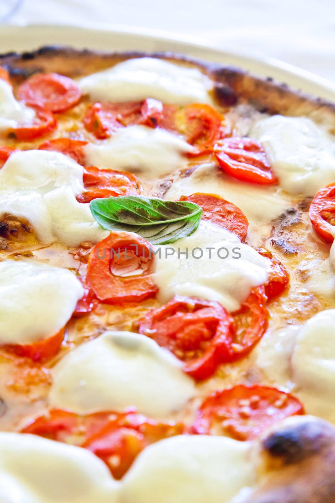 This is a true Italian Pizza. Traditional Pizza Margherita served in a Capri's restaurant, Naples Gulf, Italy.