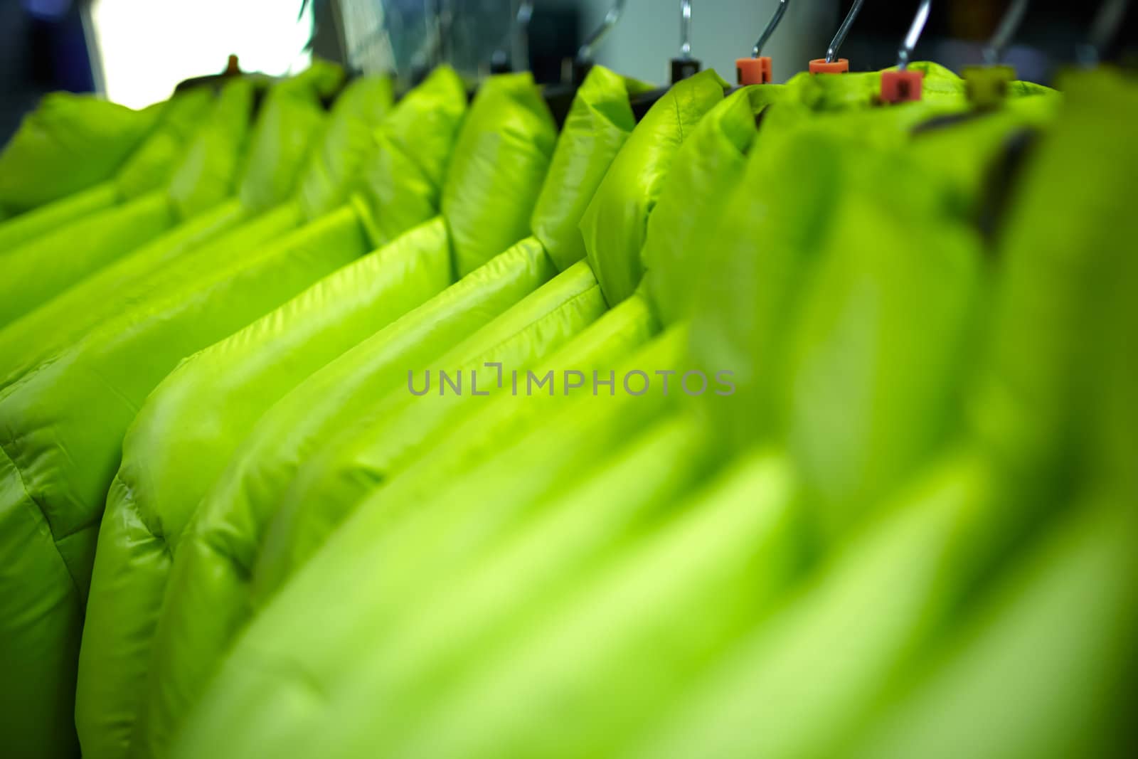 Sport and casual clothes on hangers in the shop.