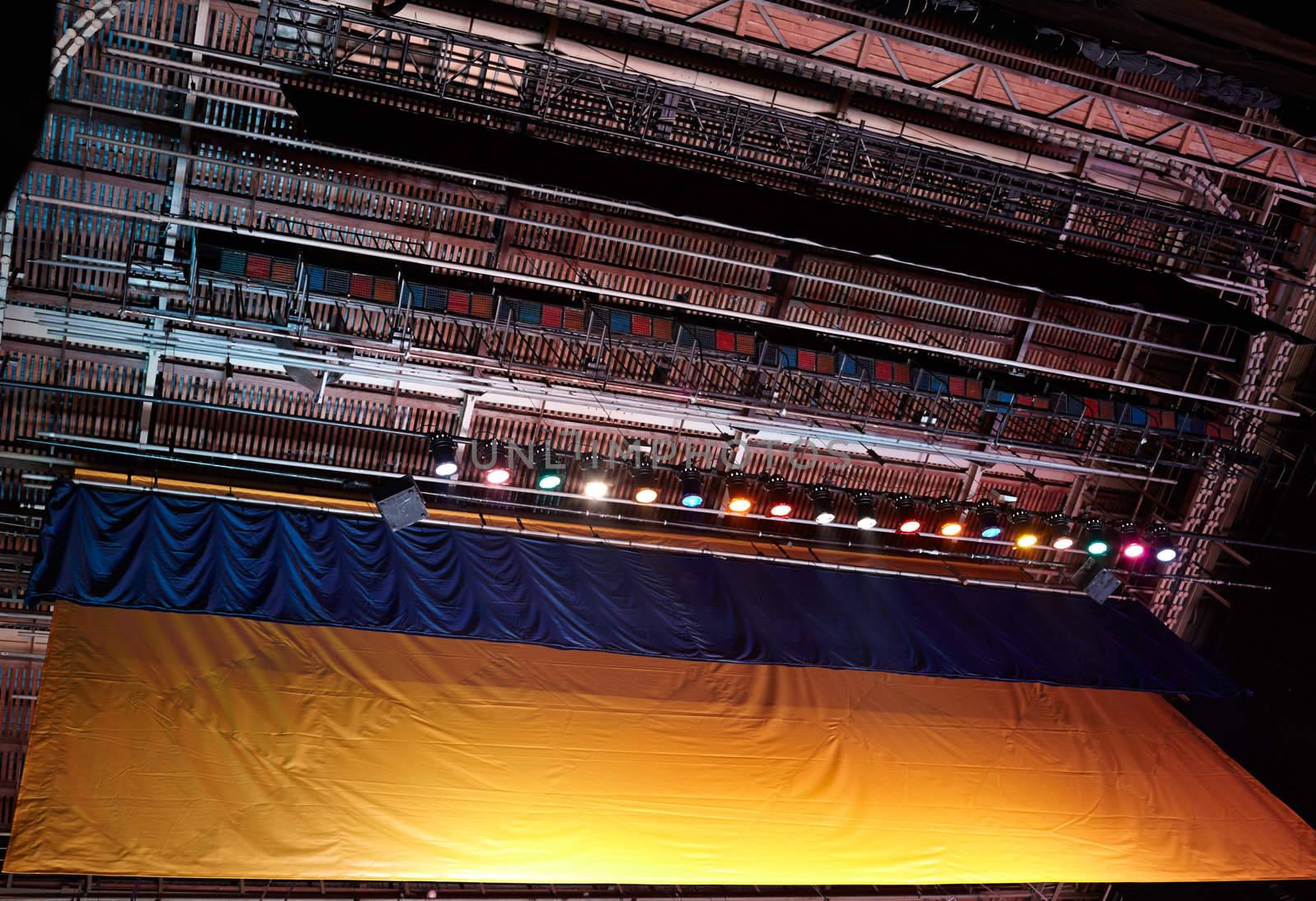 Dark theatre scaffold from low angle - construction background with spotlights.