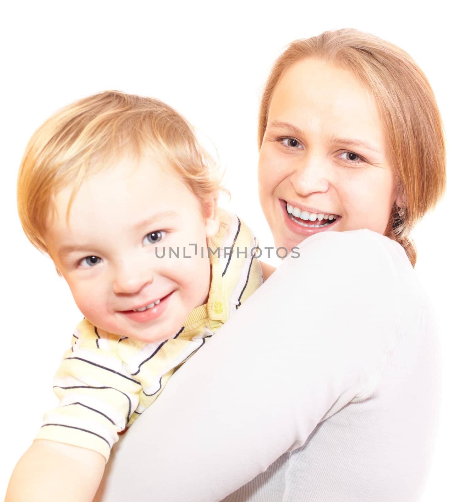 Young mother with her son are hugging and laughing. Focus is on the mother's face. Shallow dof. Isolated on white.