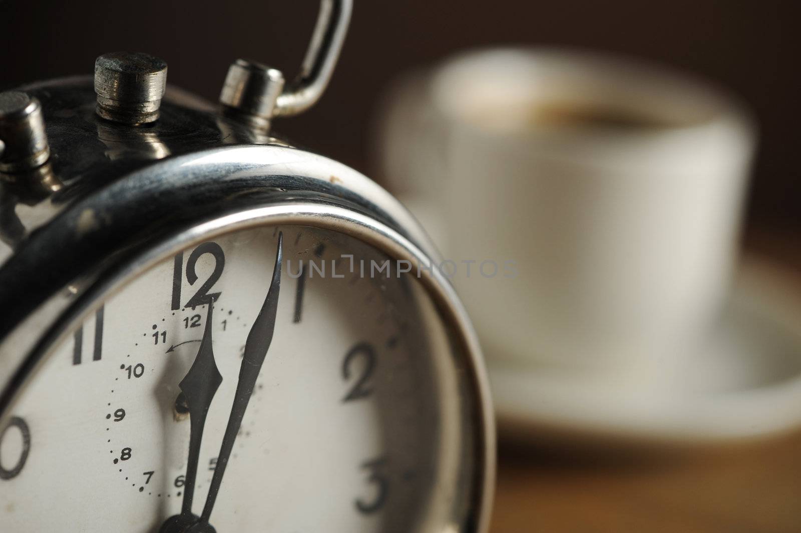 Alarm clock and coffee cup 