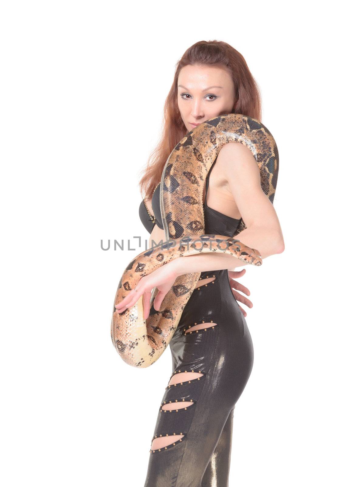 Sexy attractive young woman in leathers posing with her boa wound round her body