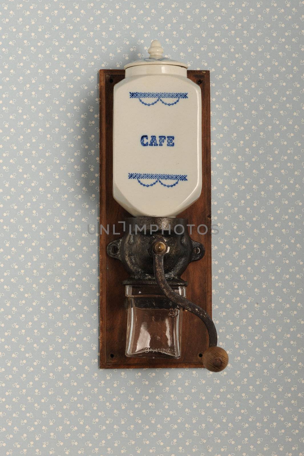 Coffee grinder on vintage background