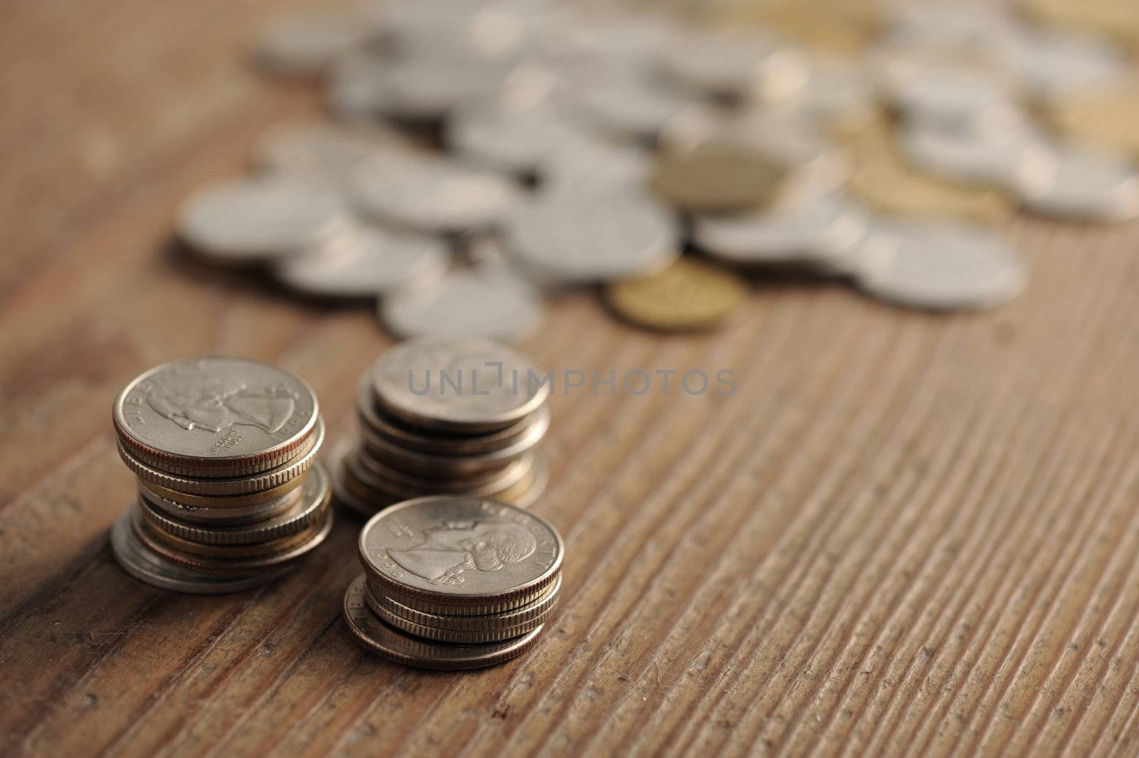 old coins on the wooden table, shallow dof