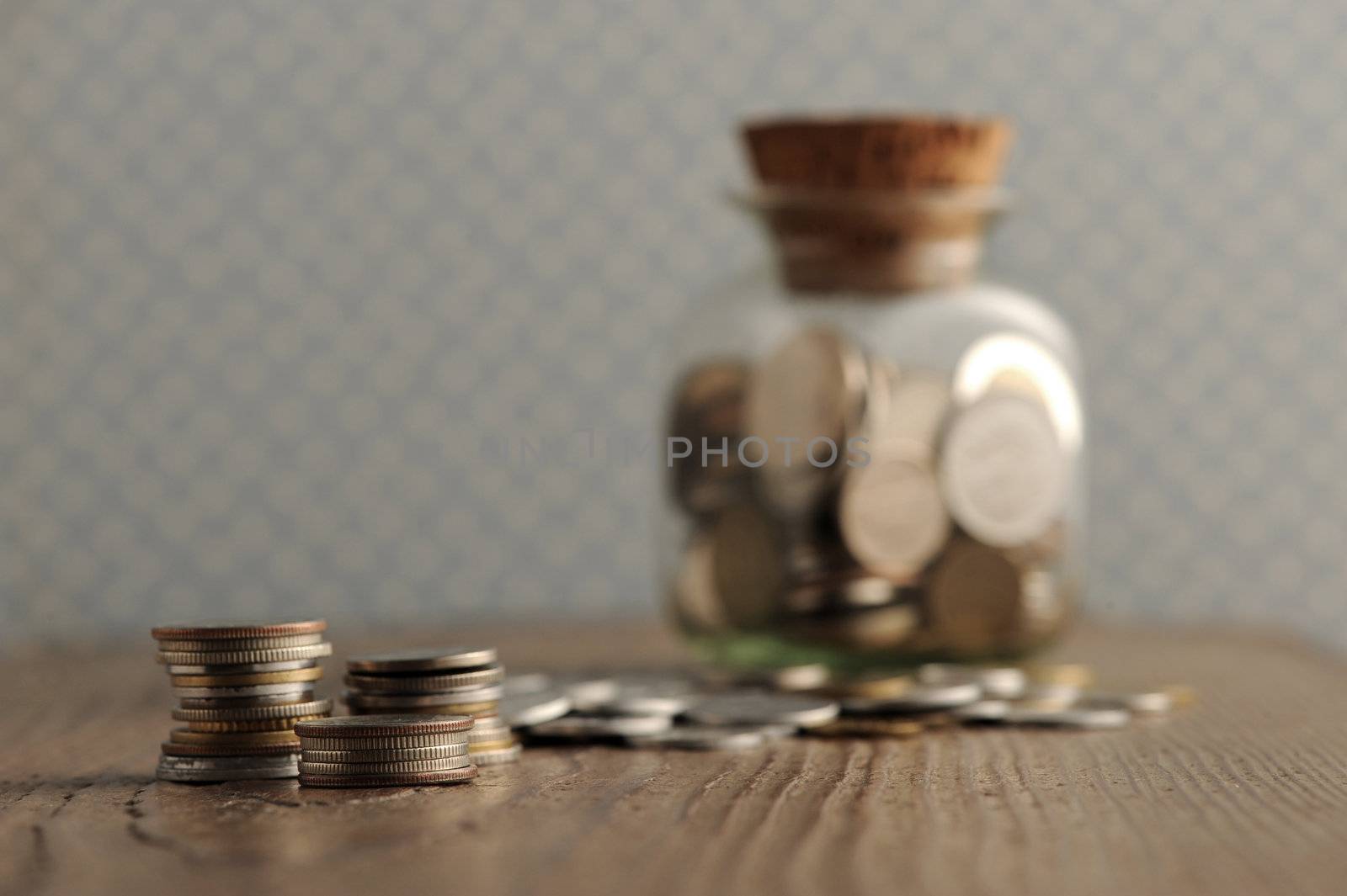 old coins on the wooden table, shallow dof by stokkete