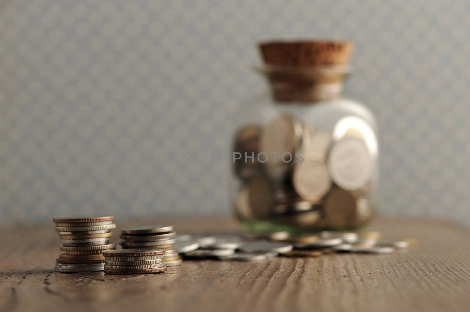 old coins on the wooden table, shallow dof