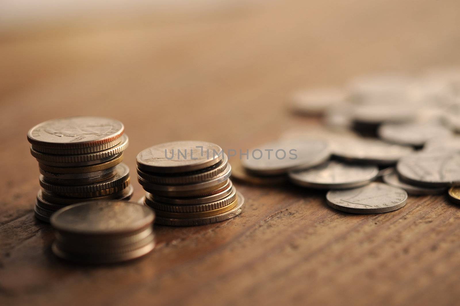 old coins on the wooden table, shallow dof by stokkete