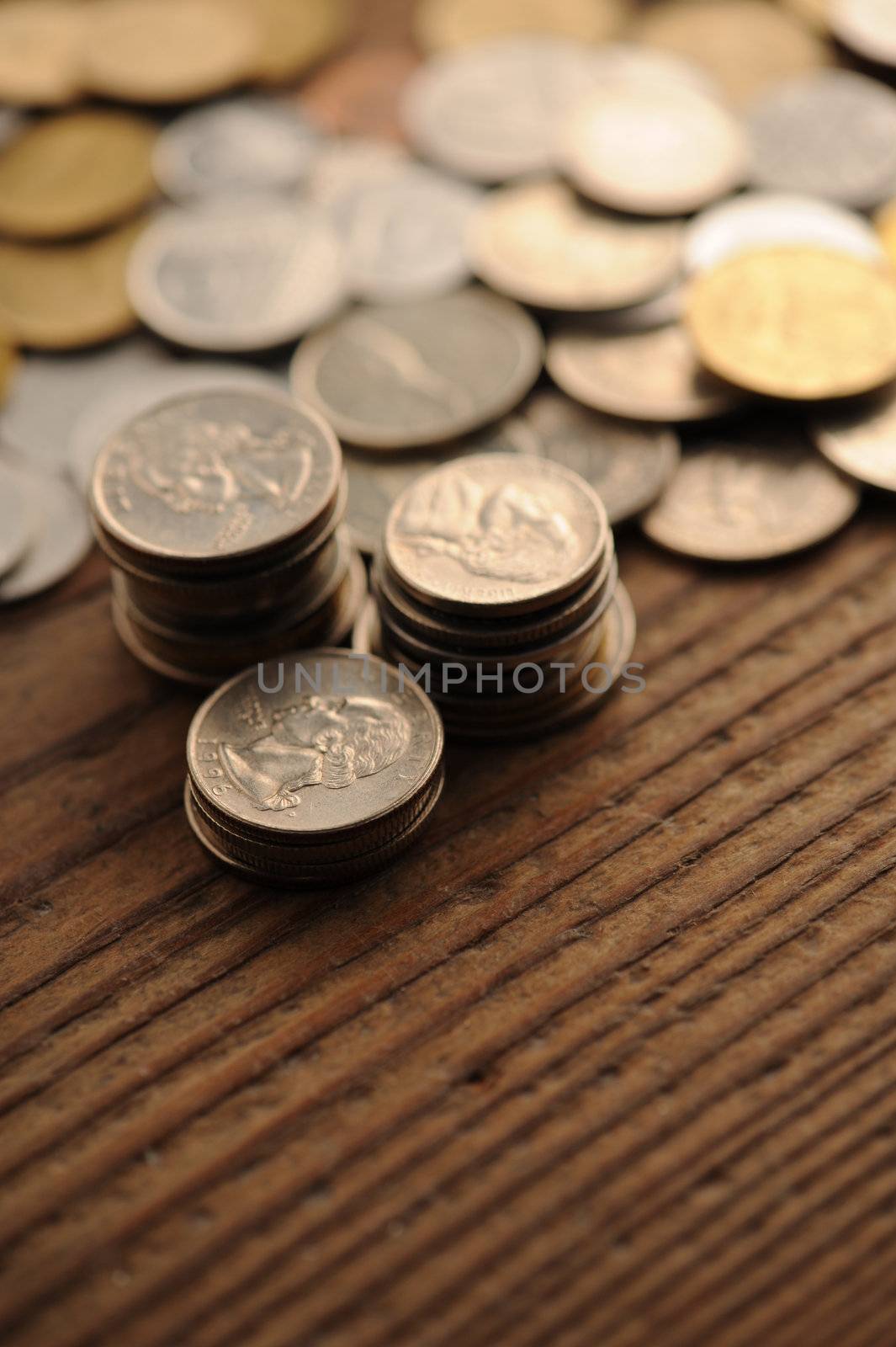 old coins on the wooden table, shallow dof by stokkete