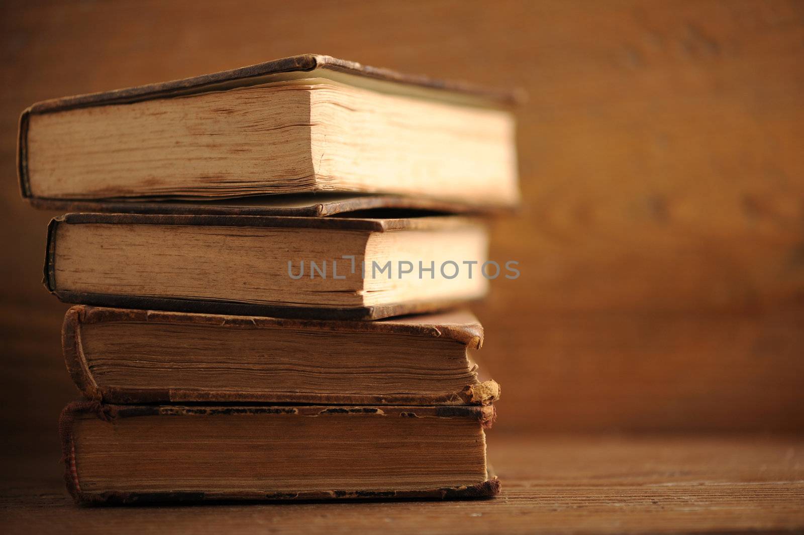 old book close up, soft focus by stokkete