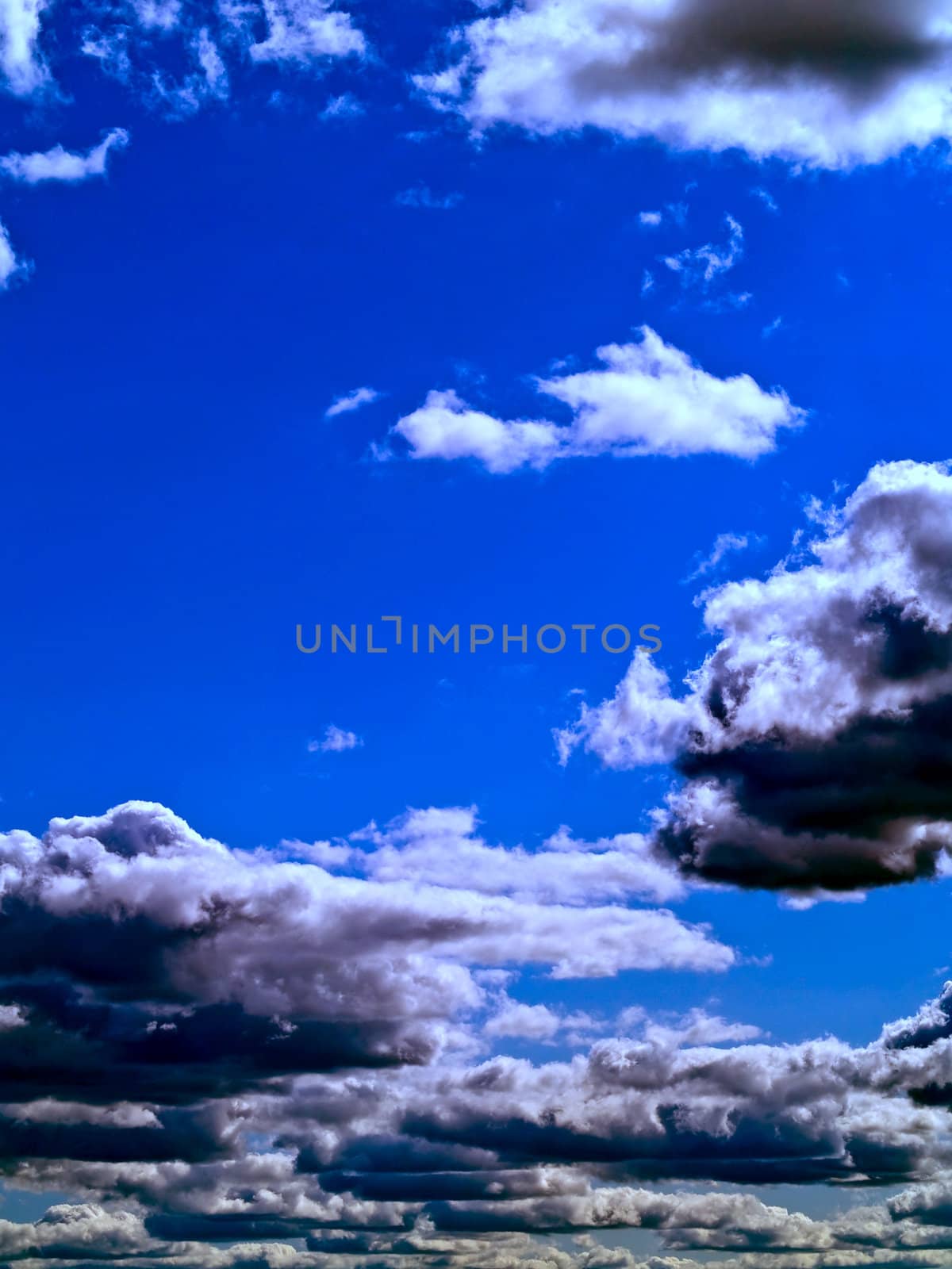 Gray and white clouds on a blue sky